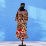 African dress with lace designs and hair wrap 