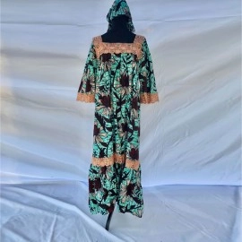 African dress with lace designs and hair wrap